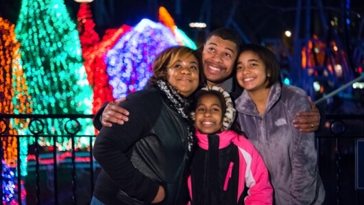 Family in front of lights at Candylane