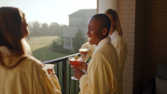 Guests in a robe on the balcony at the Chocolate Spa