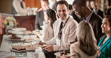Guests enjoying desserts at a conference