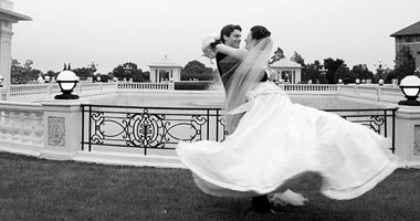 Bride & Groom twirling by The Hotel Hershey fountains