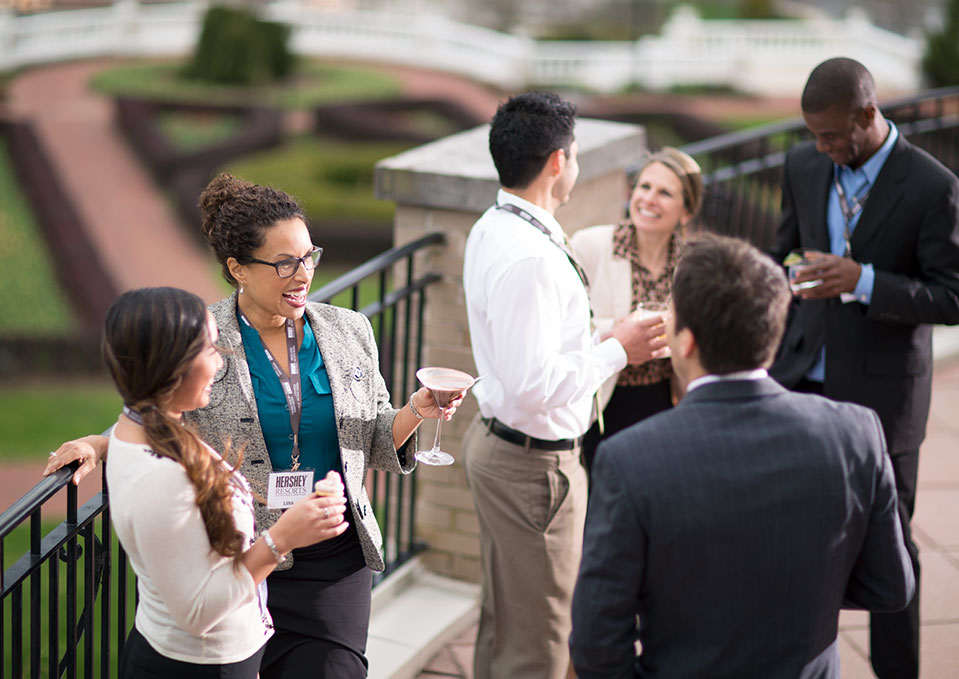 Woman and colleagues meeting on the veranda