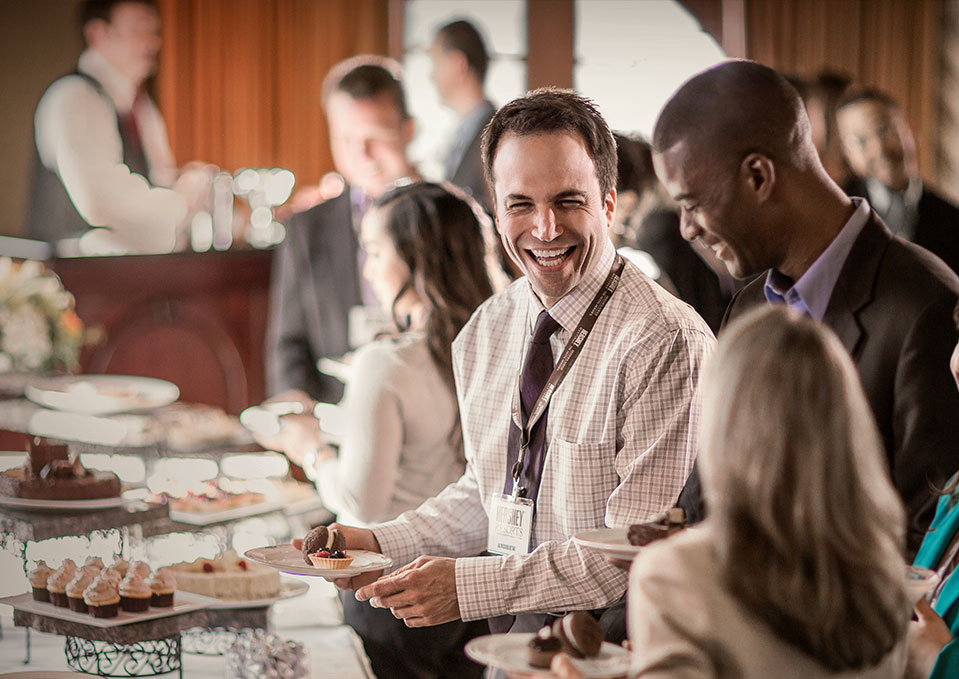 Man and colleagues enjoying buffet at The Hotel Hershey