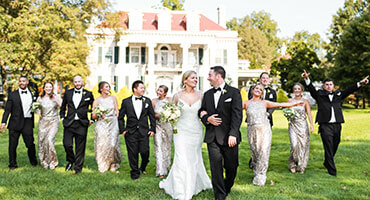 Bride and groom driving away on a golf cart at Hershey Country Club