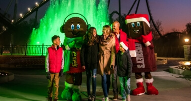 Family in front of Kisses fountain at Hersheypark Christmas Candylane