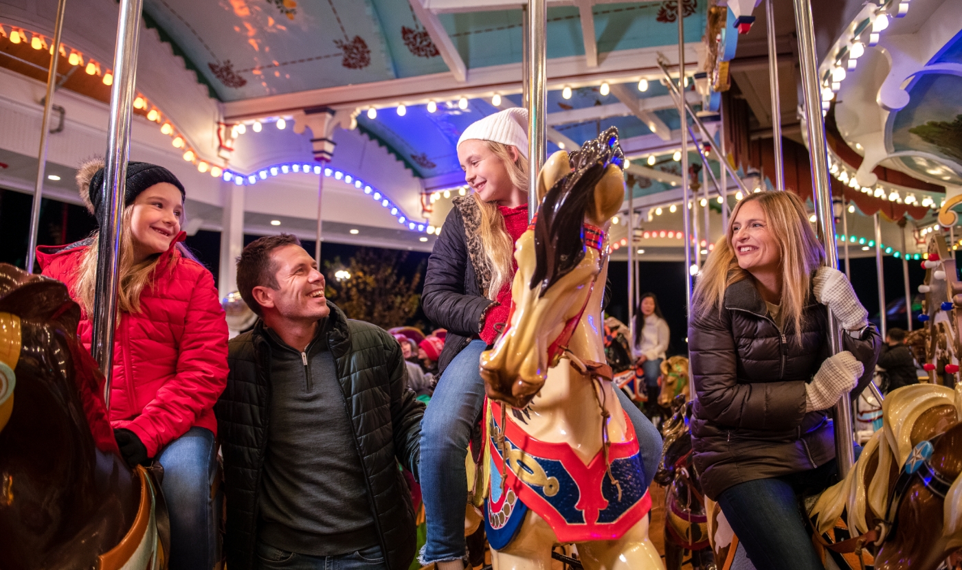 Family on carrousel at Hersheypark Christmas Candylane