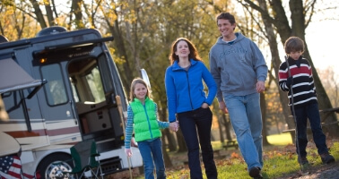 Family walking at rv campsite at Hersheypark Camping Resort