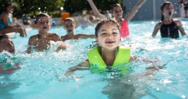 Girl in pool at Hersheypark Camping Resort
