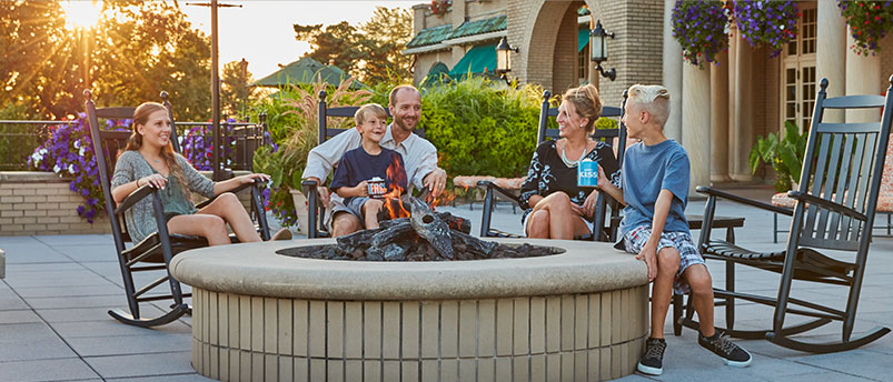 Family enjoying outdoor firepit at The Hotel Hershey