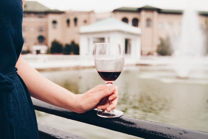 woman holding wine glass