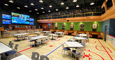 big screen tv and seating at The Bears' Den inside Hershey Lodge