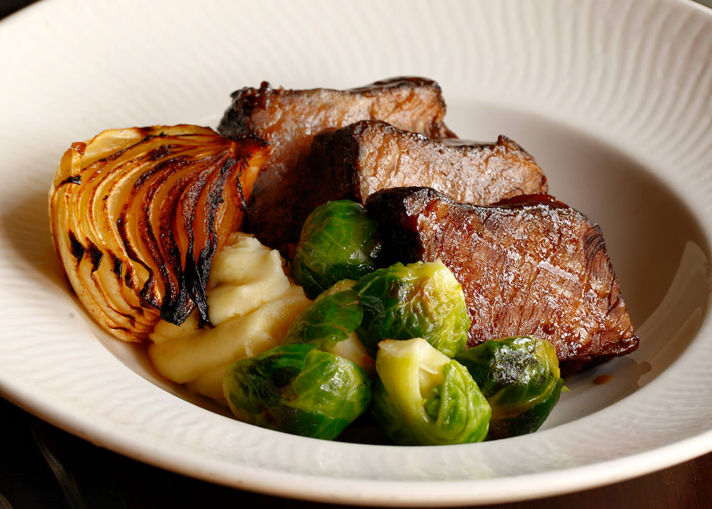 Plated steak and brussel sprouts