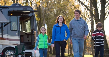 Family in front of RV at Hersheypark Camping Resort