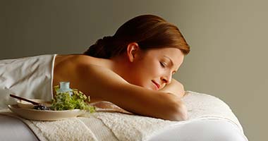Woman lying on massage table
