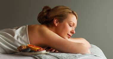 Woman lying on massage table