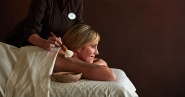 Woman getting a chocolate treatment